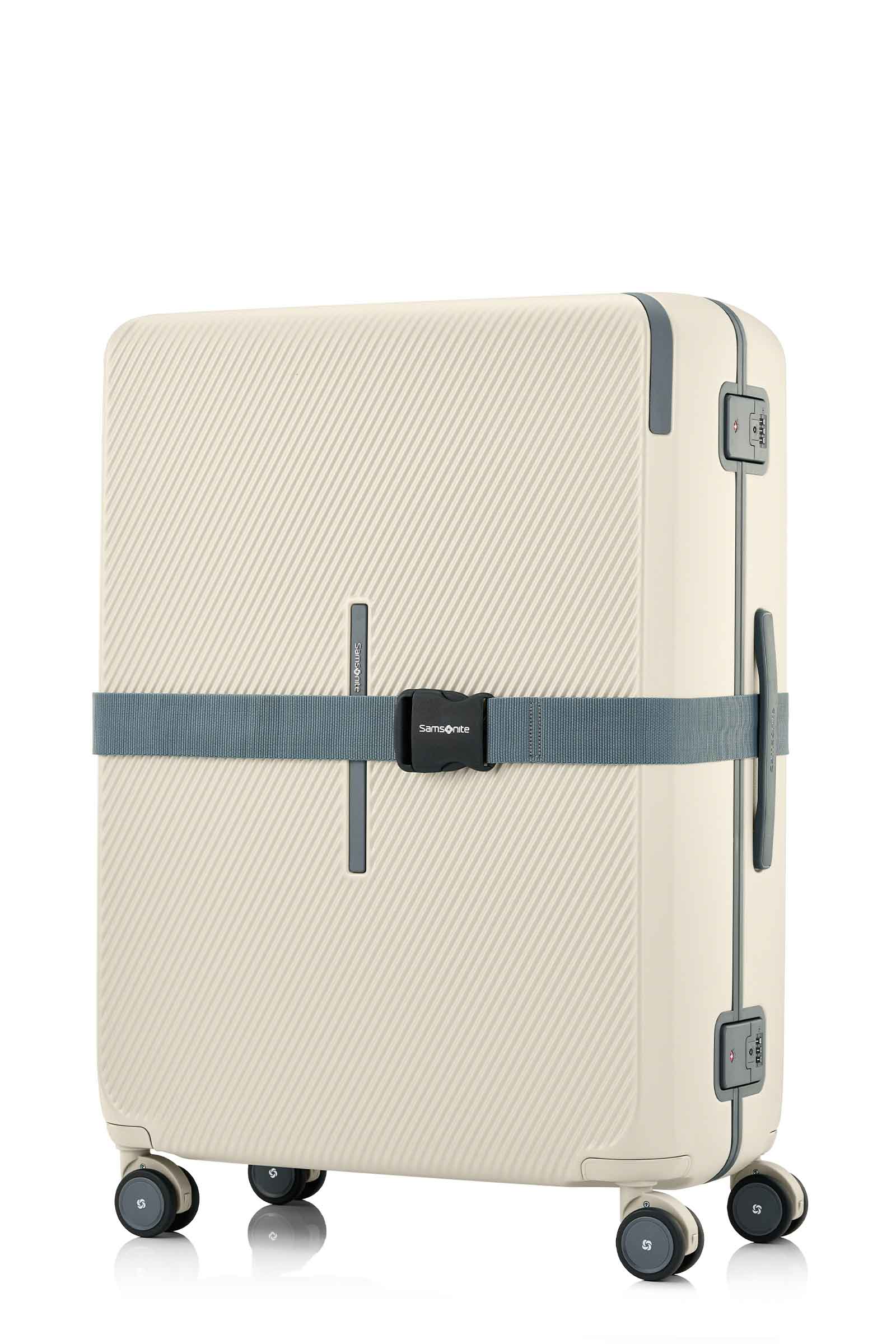 Angled view of the Evox Spinner Large luggage in Beige strapped. Shop the Collection Online.