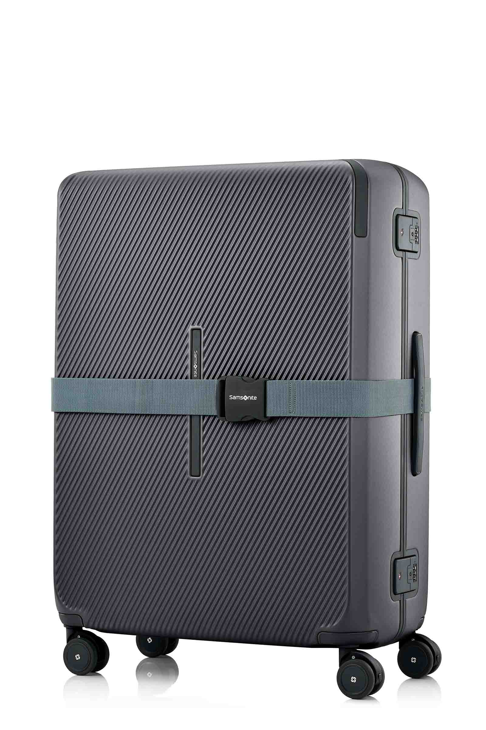 Angled view of the Evox Spinner Large luggage in Graphite strapped. Shop the Collection Online.