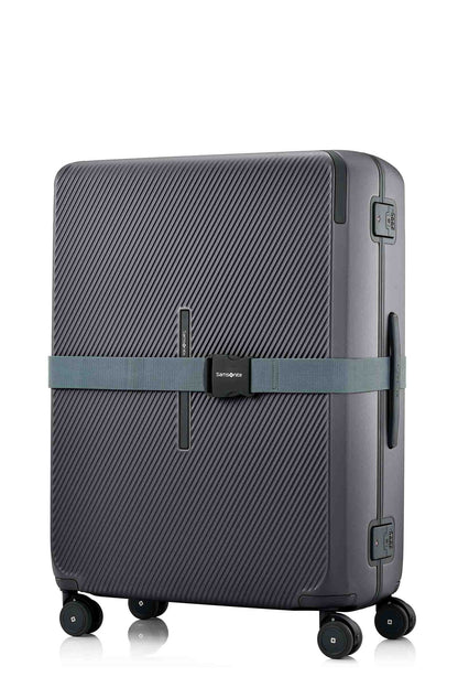 Angled view of the Evox Spinner Large luggage in Graphite strapped. Shop the Collection Online.