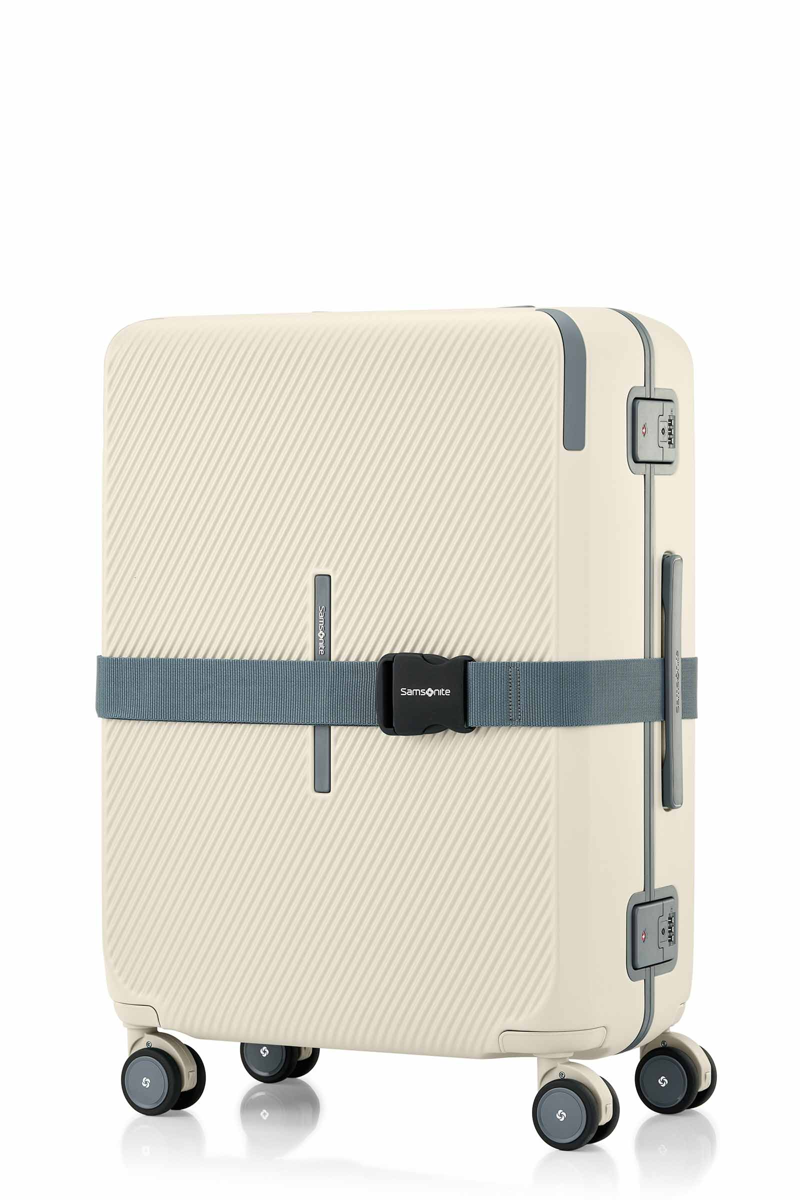 Angled view of the Evox Spinner Medium luggage in Beige strapped. Shop the Collection Online.