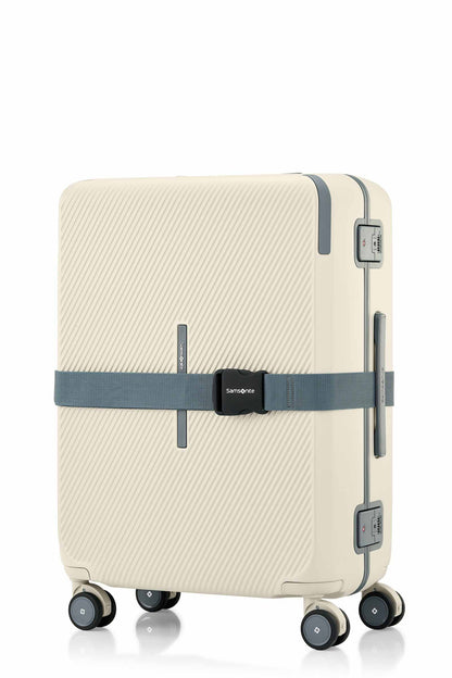 Angled view of the Evox Spinner Medium luggage in Beige strapped. Shop the Collection Online.