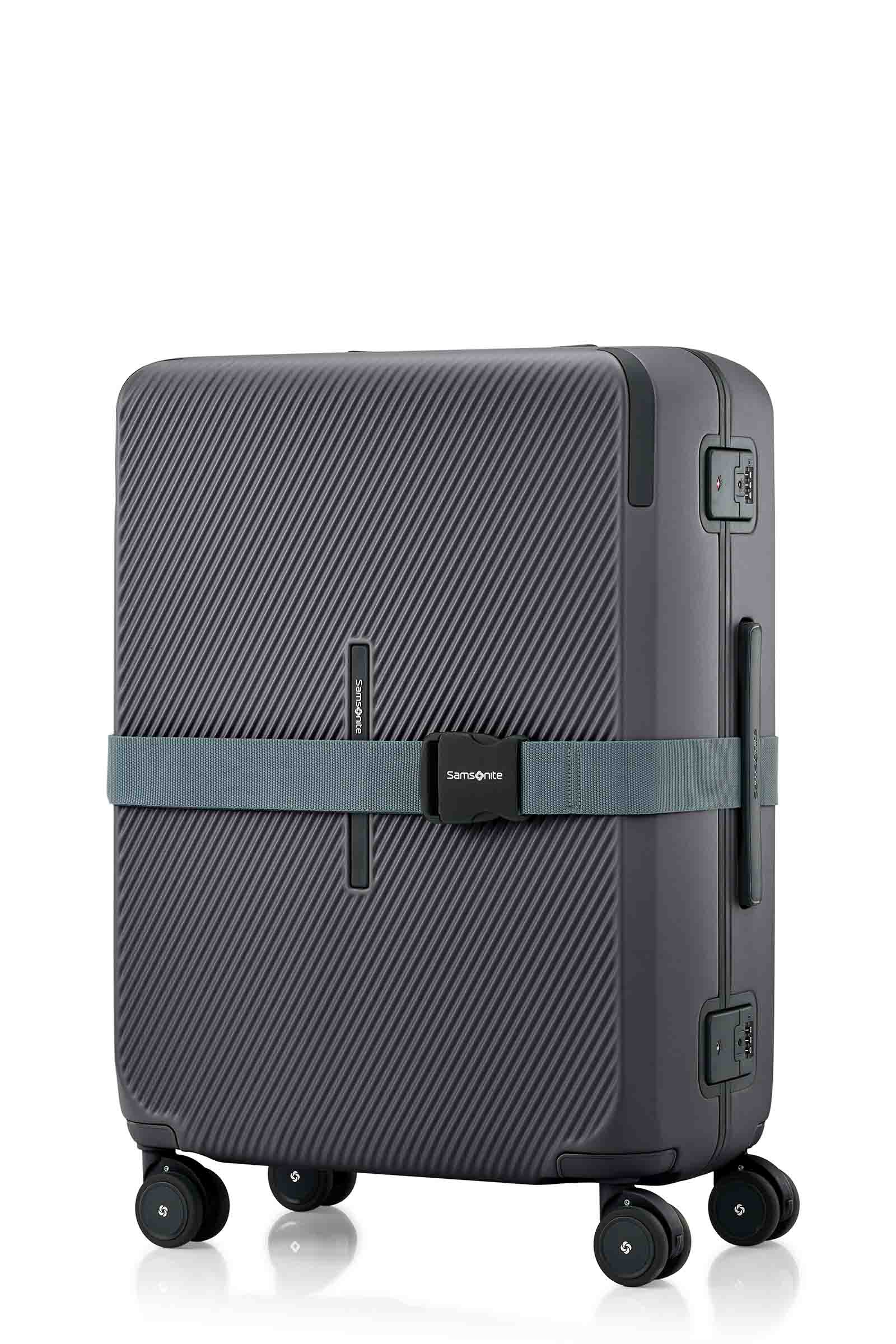 Angled view of the Evox Spinner Medium luggage in Graphite strapped. Shop the Collection Online.