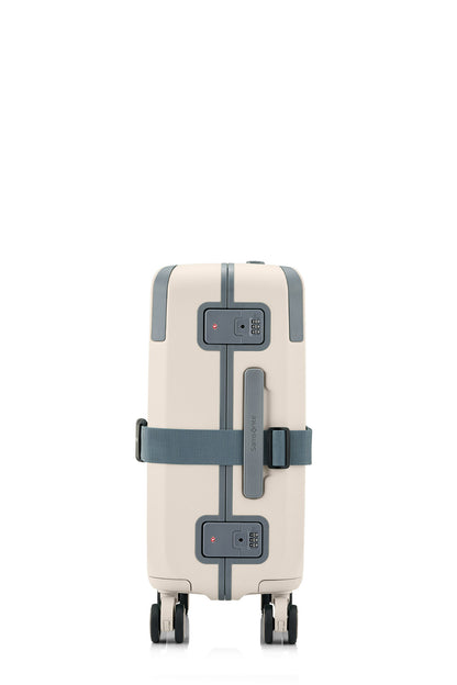 Side view of the Evox Spinner Cabin luggage in Beige strapped. Shop the Collection Online.