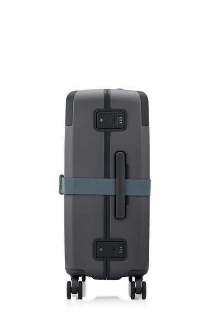Side view of the Evox Spinner Medium luggage in Graphite strapped. Shop the Collection Online.