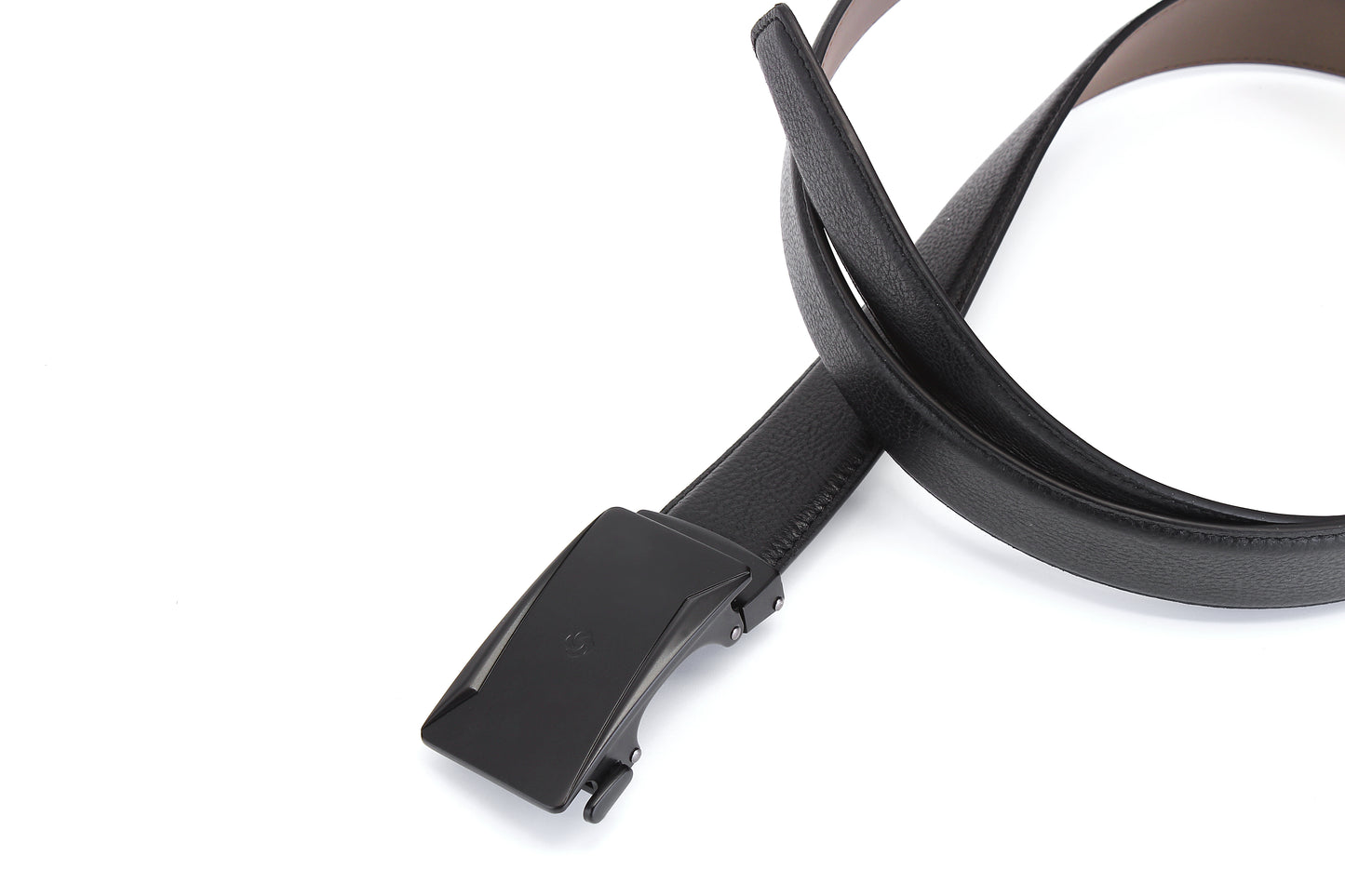 Twirled belt buckle view of the AAMIR Casual Auto Belt in Black. Find the Collection Online.