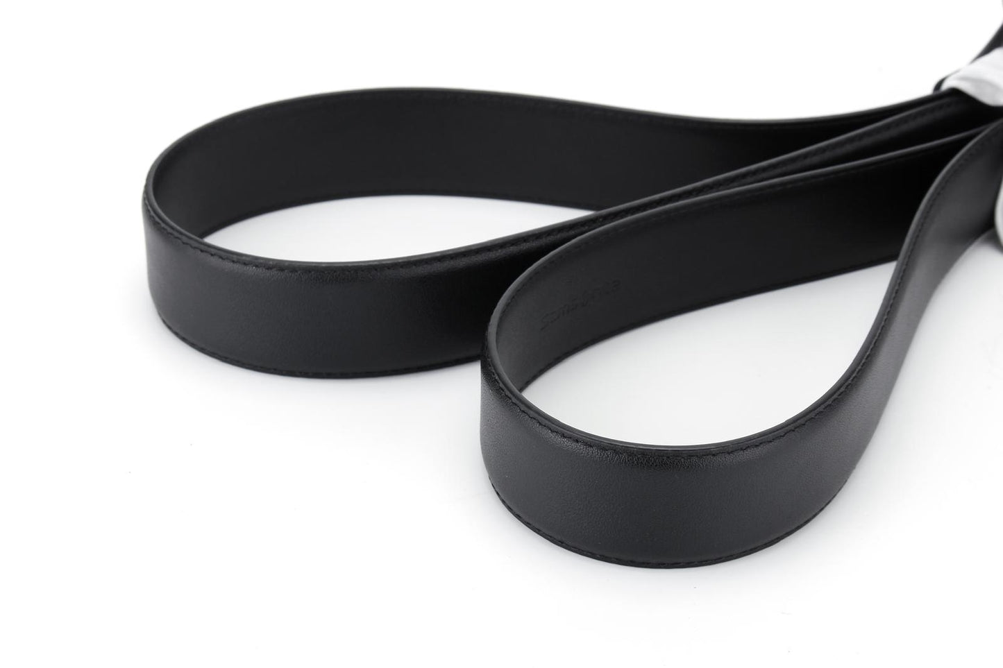 stitching front view of the AAMIR Basic Auto Golden Logo Belt in Black. Shop Online Today.